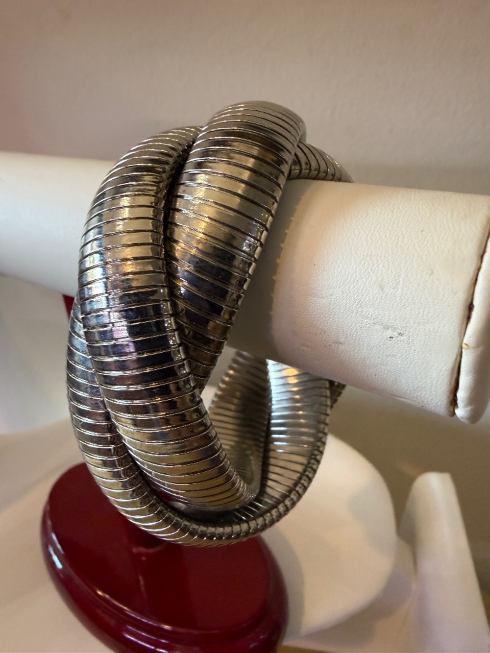 Silver triple loop bangle bracelet.